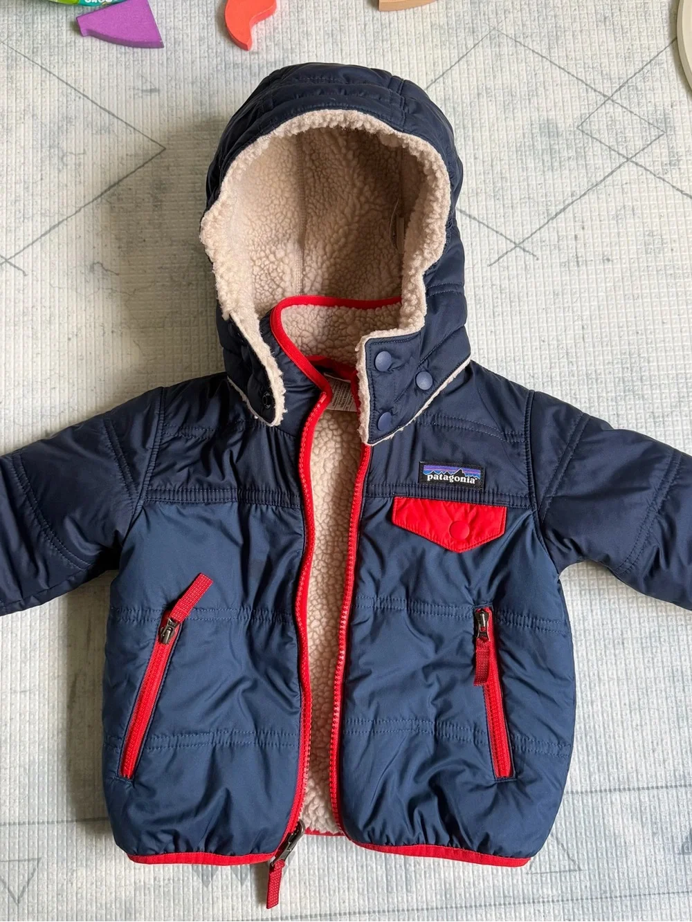 Patagonia Kids Navy Jacket with Red Trim and Cream Sherpa Lining